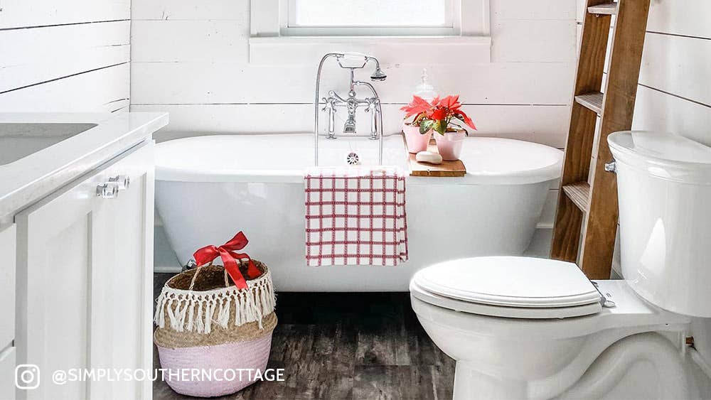 Holiday double ended clawfoot tub in a farmhouse bathroom