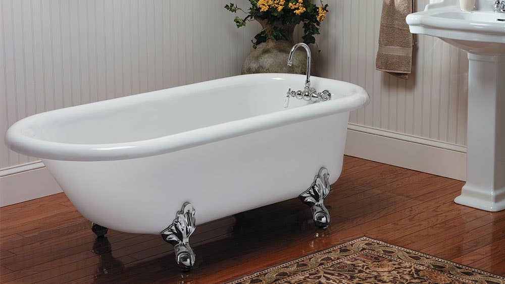  Roll top cast iron clawfoot tub in a vintage styled bathroom